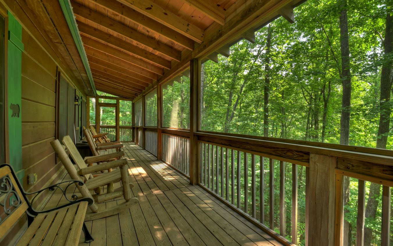 664 Laurel Ridge Road Blue Ridge, GA 30513 - Photo 3 of 36 a view of balcony with couch and wooden floor