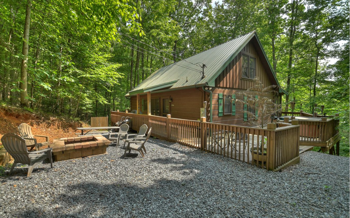 664 Laurel Ridge Road Blue Ridge, GA 30513 - Photo 32 of 36 a view of backyard with deck and garden
