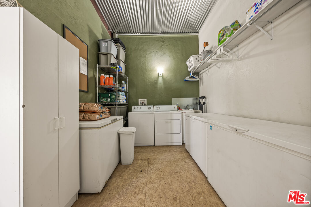 9025 Camp Rock Road Lucerne Valley, CA 92356 - Photo 30 of 54 a utility room with cabinets washer and dryer