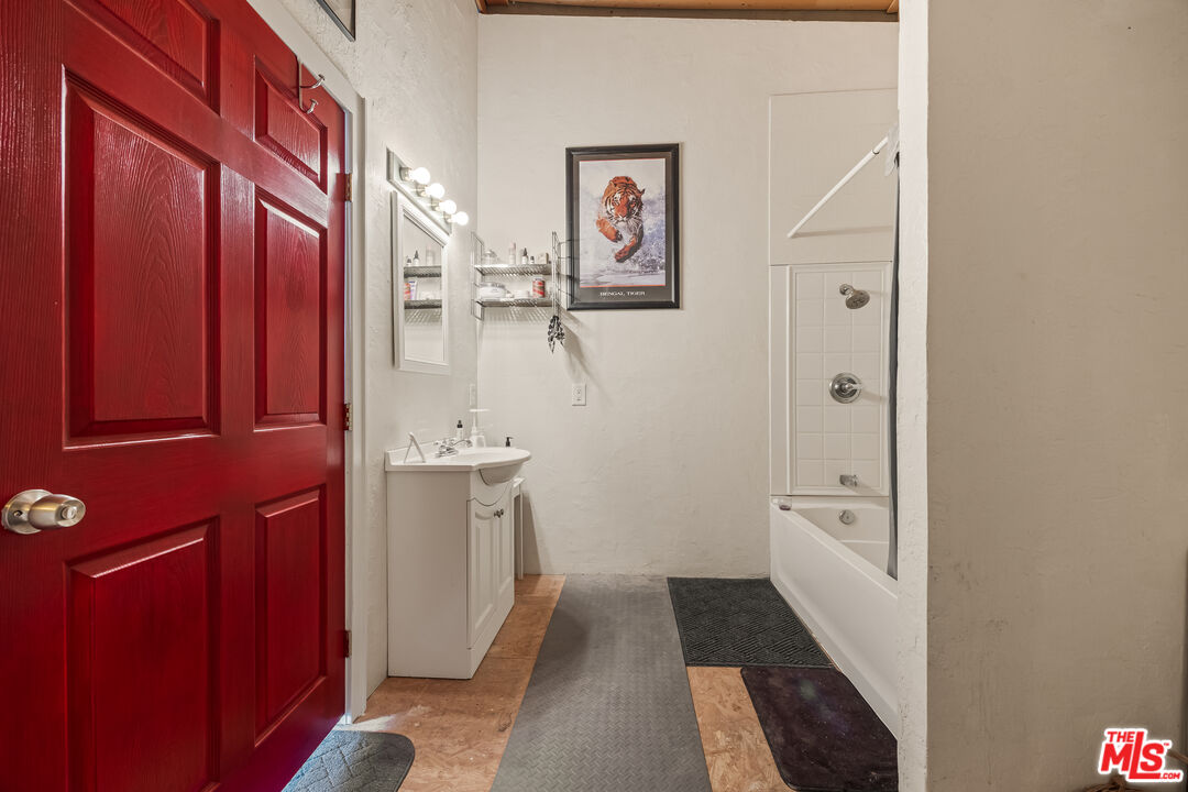 9025 Camp Rock Road Lucerne Valley, CA 92356 - Photo 34 of 54 a bathroom with a sink a toilet and shower