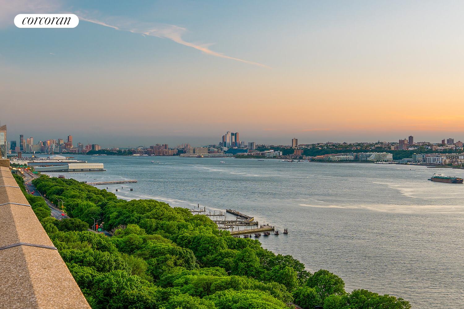 140 Riverside Drive, Unit 19HO Manhattan, NY 10024 - Photo 15 of 35 a view of a lake with houses in the back