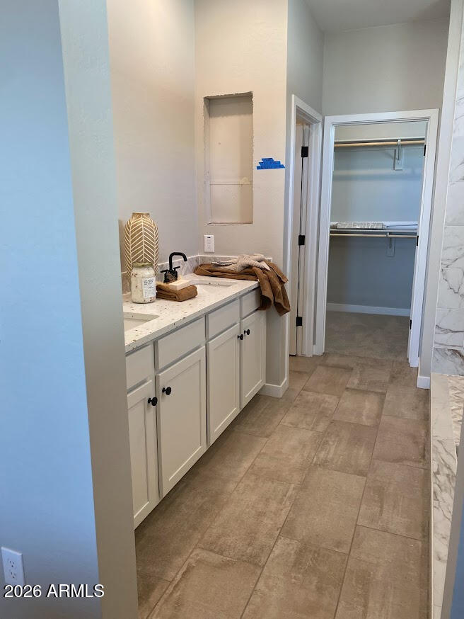17547 West Fulton Street Goodyear, AZ 85338 - Photo 7 of 10 a view of a bathroom with a sink and mirror