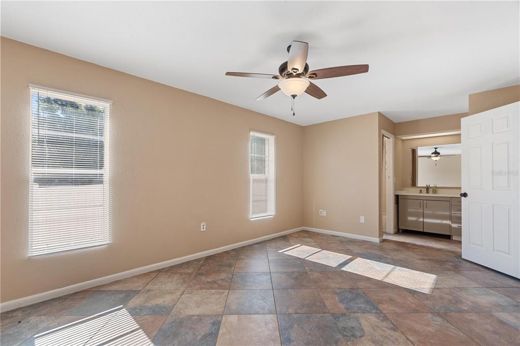 6007 Waycross Drive Spring Hill, FL 34606 - Photo 13 of 33 a view of livingroom with a ceiling fan and windows