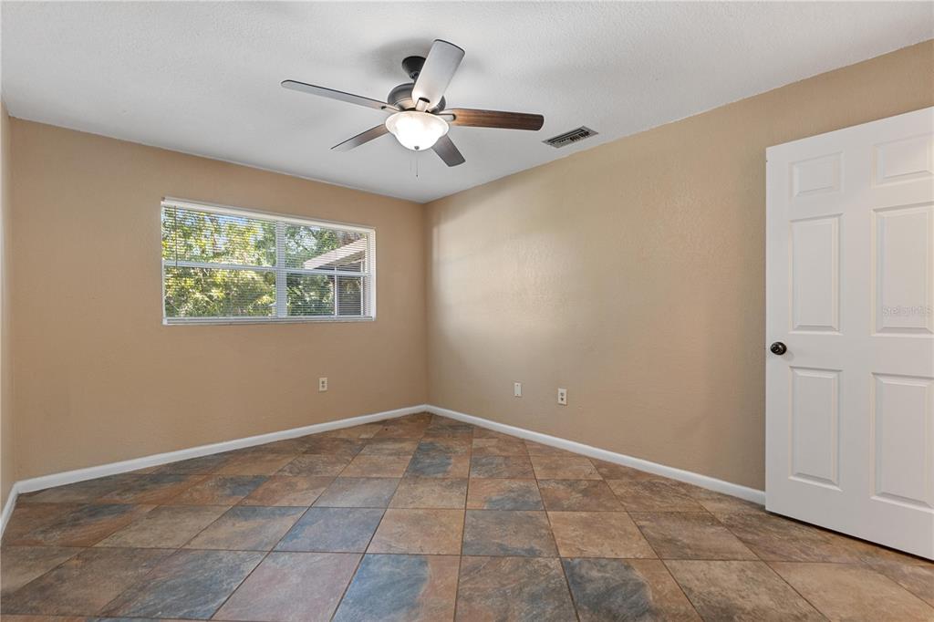 6007 Waycross Drive Spring Hill, FL 34606 - Photo 21 of 33 a view of an empty room with a window