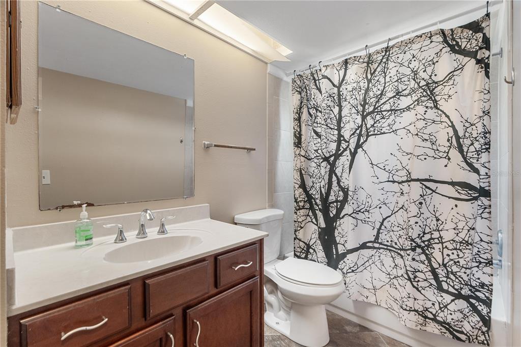6007 Waycross Drive Spring Hill, FL 34606 - Photo 22 of 33 a bathroom with a sink toilet and vanity