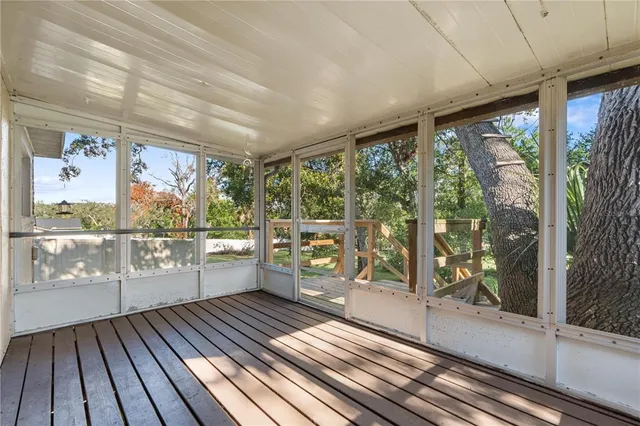 a view of a livingroom with a ceiling fan and window