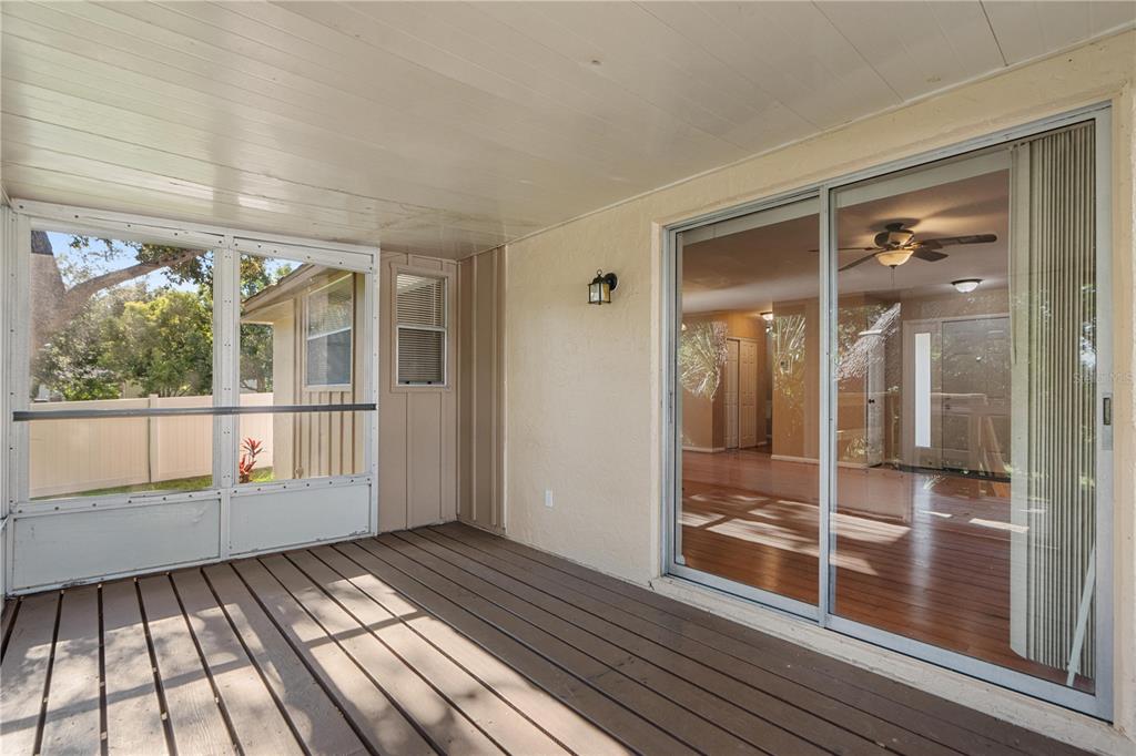6007 Waycross Drive Spring Hill, FL 34606 - Photo 25 of 33 wooden floor view of an empty room with wooden floor and a window