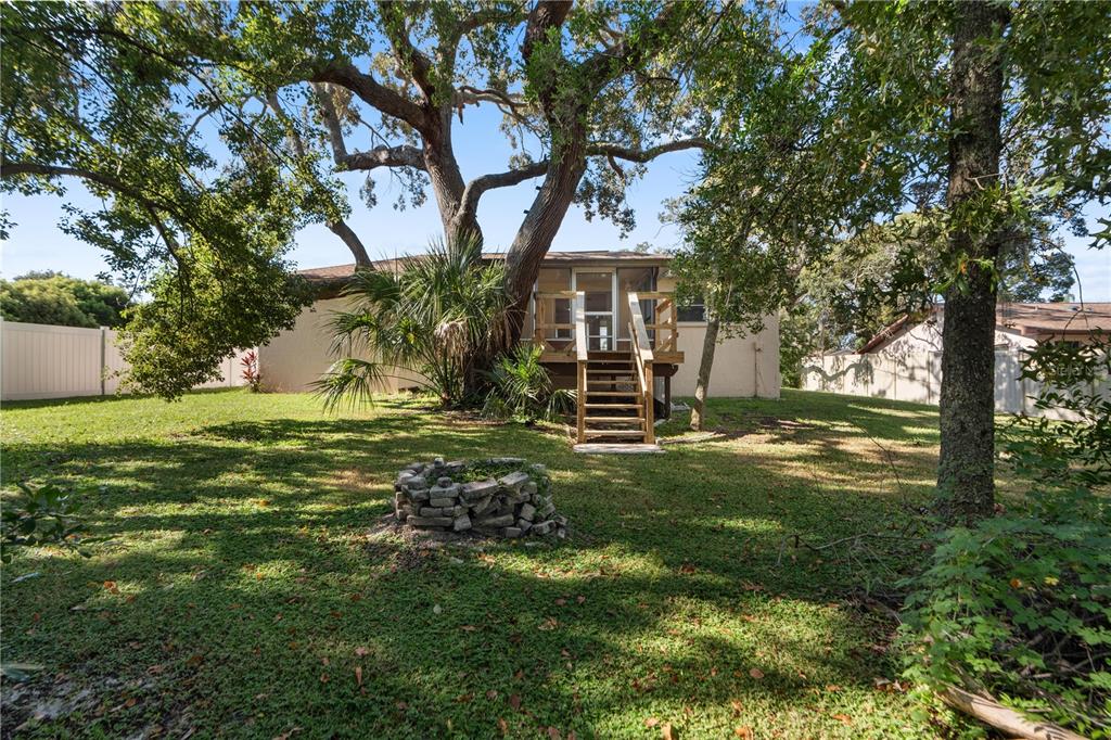 6007 Waycross Drive Spring Hill, FL 34606 - Photo 33 of 33 a view of a tree in front of a house with a yard