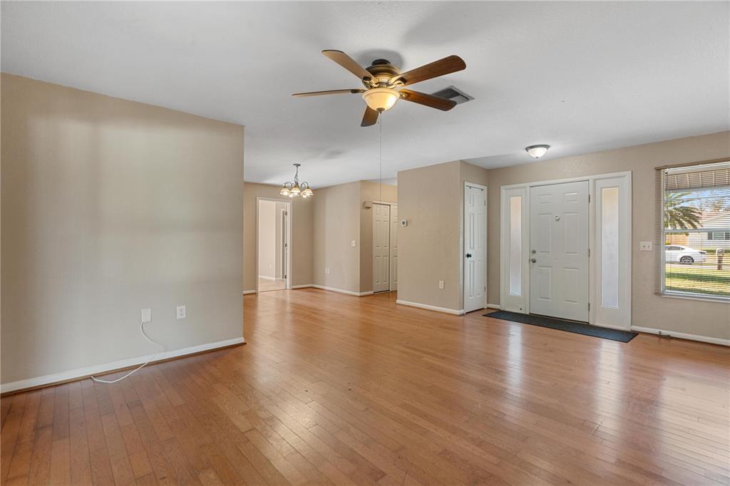 6007 Waycross Drive Spring Hill, FL 34606 - Photo 5 of 33 a view of an empty room and wooden floor
