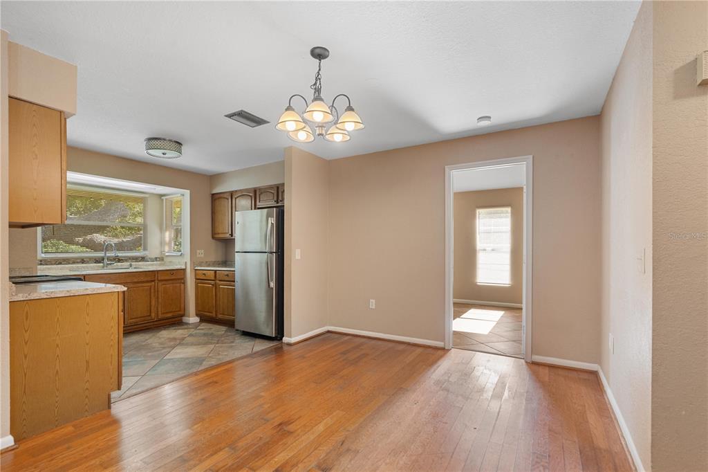 6007 Waycross Drive Spring Hill, FL 34606 - Photo 6 of 33 a view of a kitchen with a sink a refrigerator and window
