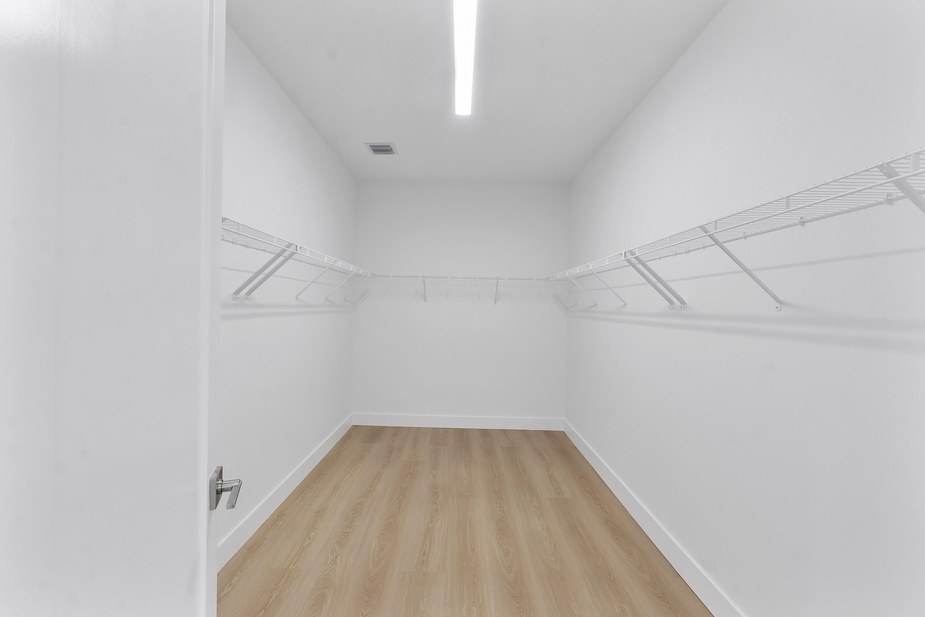 9322 Sunflower Mdw Road Boca Raton, FL 33434 - Photo 41 of 87 a view of a room with racks on the wall