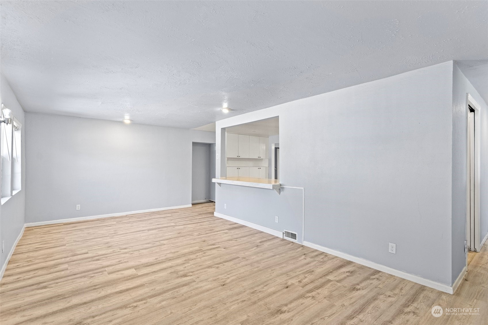 3509 Northeast 6th Street Renton, WA 98056 - Photo 3 of 26 a view of empty room with wooden floor