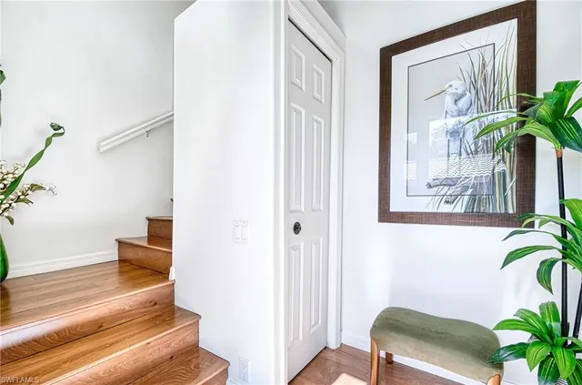 a view of a hallway with paintings on the wall