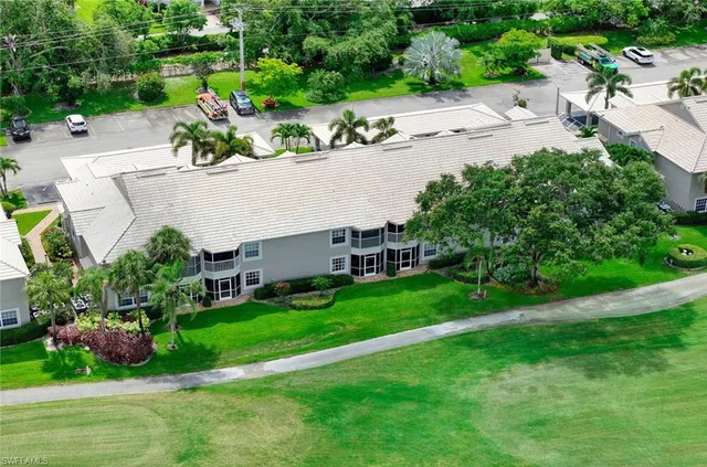 an aerial view of a house with garden space and street view