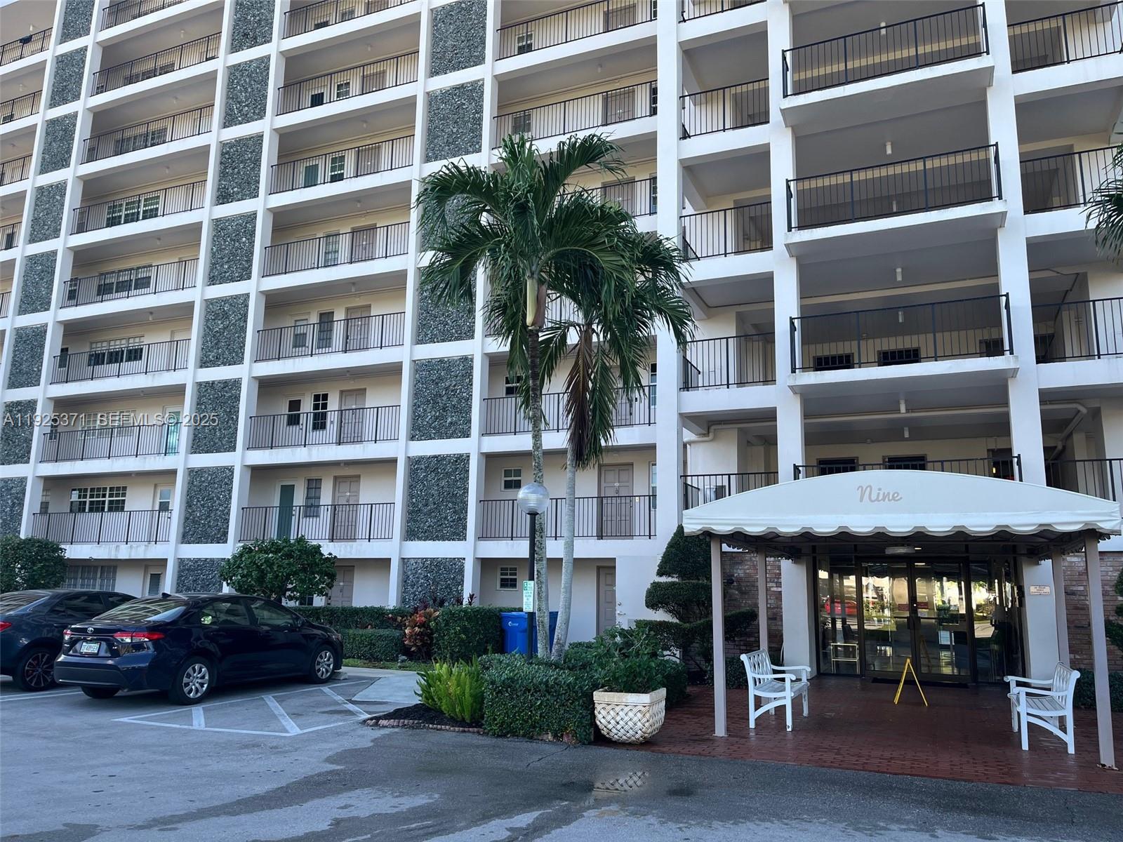 3100 North Palm Aire Drive, Unit 104 Pompano Beach, FL 33069 - Photo 3 of 20 a view of a building with potted plants