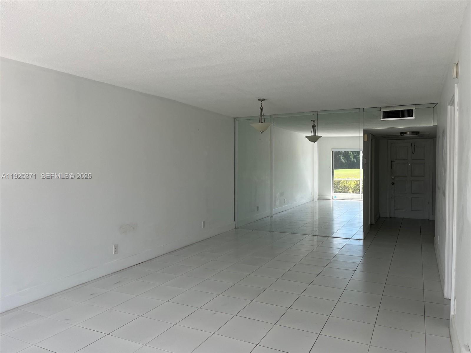 3100 North Palm Aire Drive, Unit 104 Pompano Beach, FL 33069 - Photo 9 of 20 a view of an empty room