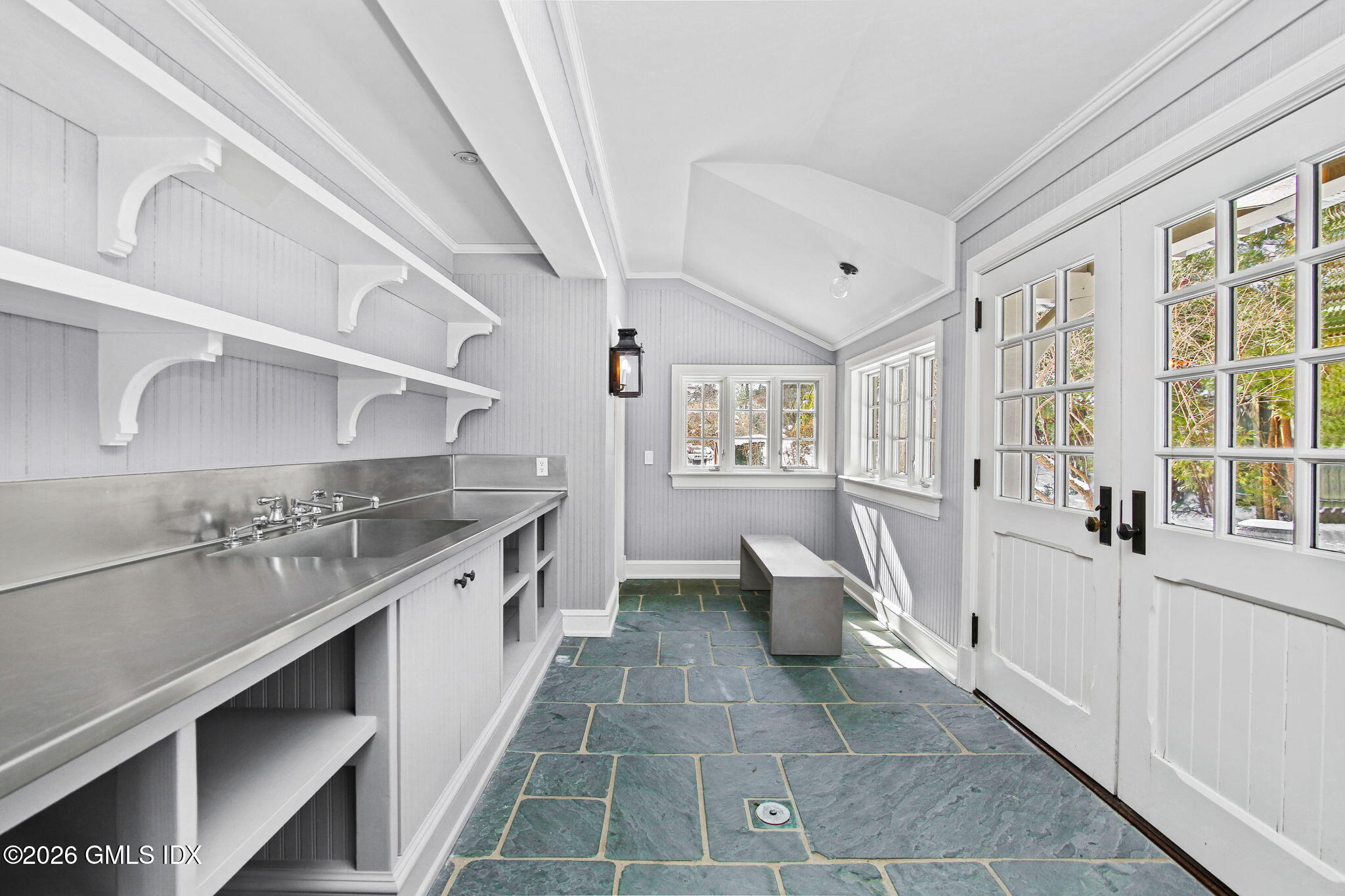 164 Round Hill Road Greenwich, CT 06831 - Photo 20 of 67 a large white kitchen with a large window