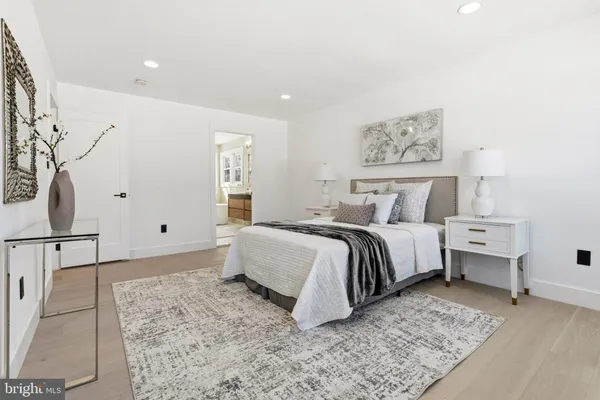 a bedroom with a bed and a couch