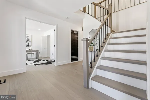 a view of staircase with white walls and windows
