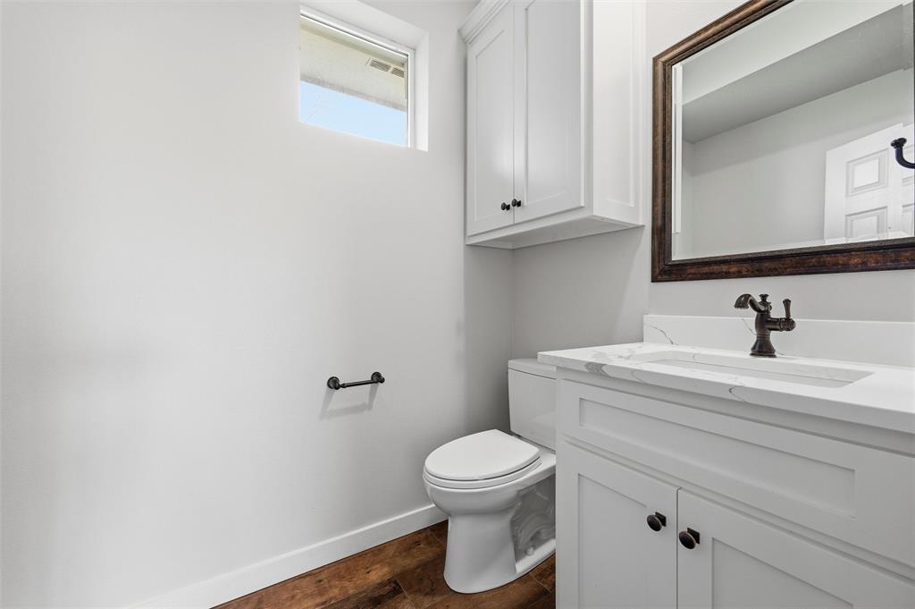 1845 Summer Lane Keller, TX 76262 - Photo 12 of 28 a bathroom with a sink a toilet and a mirror