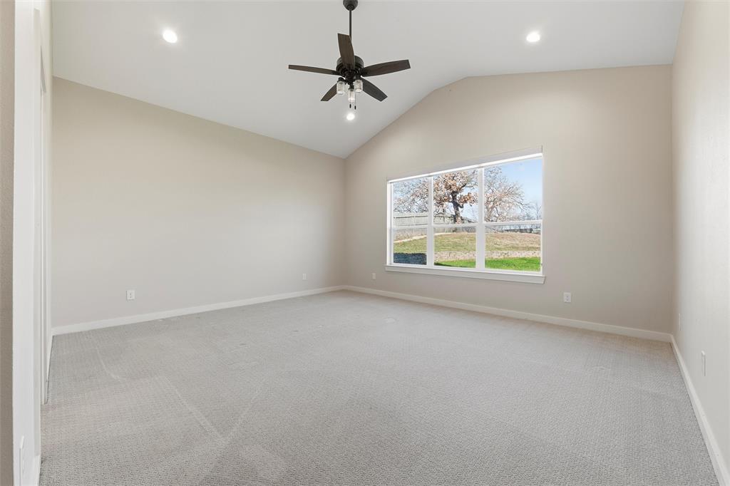 1845 Summer Lane Keller, TX 76262 - Photo 13 of 28 an empty room with windows and ceiling fan
