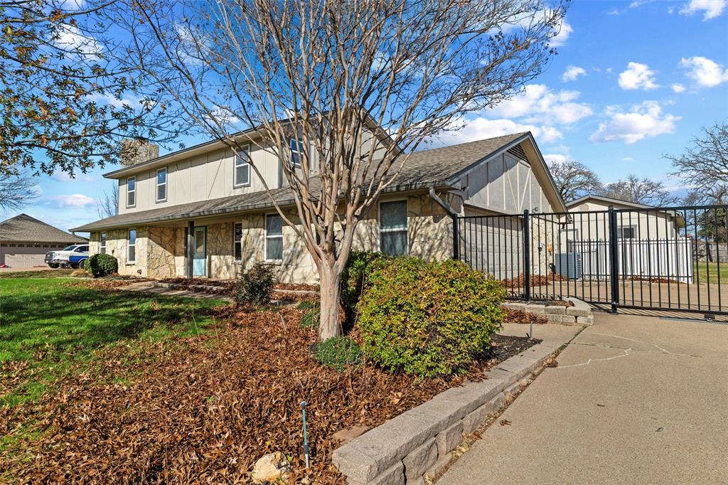 1845 Summer Lane Keller, TX 76262 - Photo 3 of 28 a front view of a house with garden