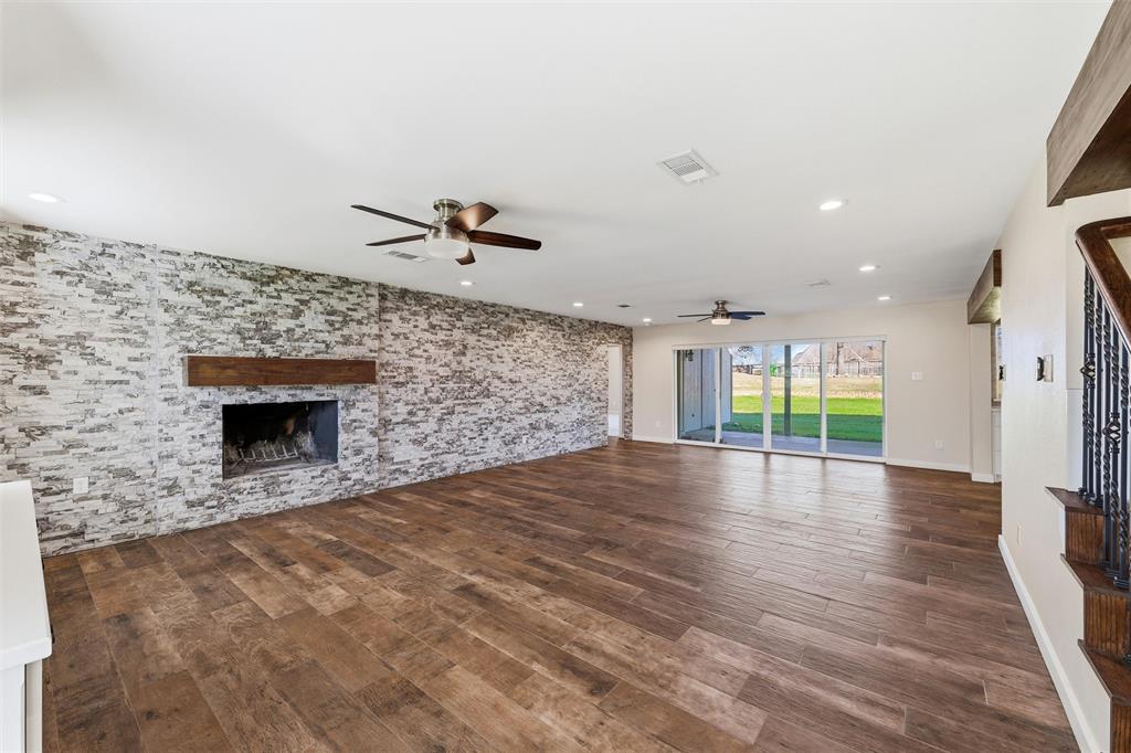 1845 Summer Lane Keller, TX 76262 - Photo 5 of 28 a view of an empty room with a fireplace and a window