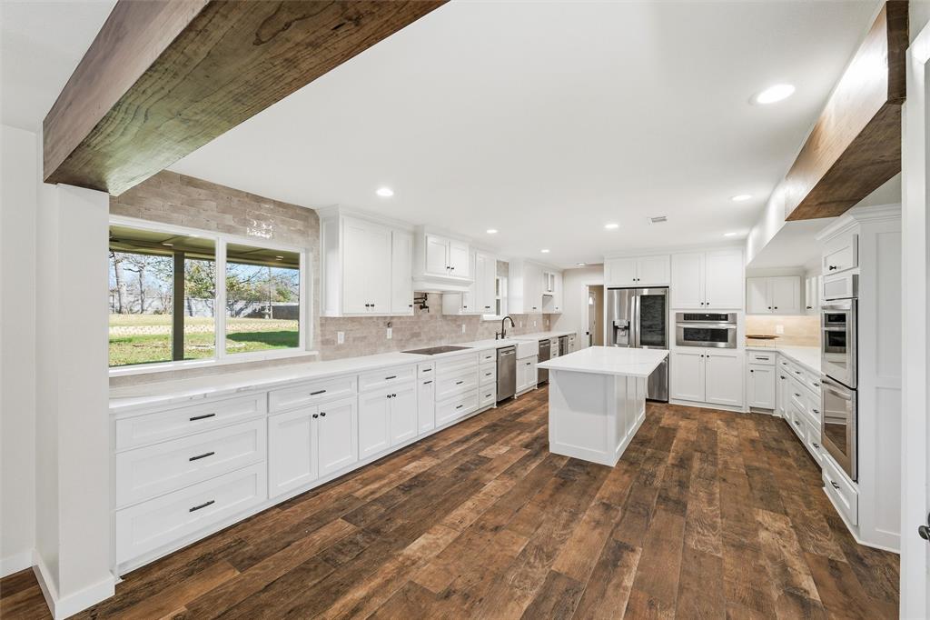 1845 Summer Lane Keller, TX 76262 - Photo 7 of 28 a large white kitchen with cabinets