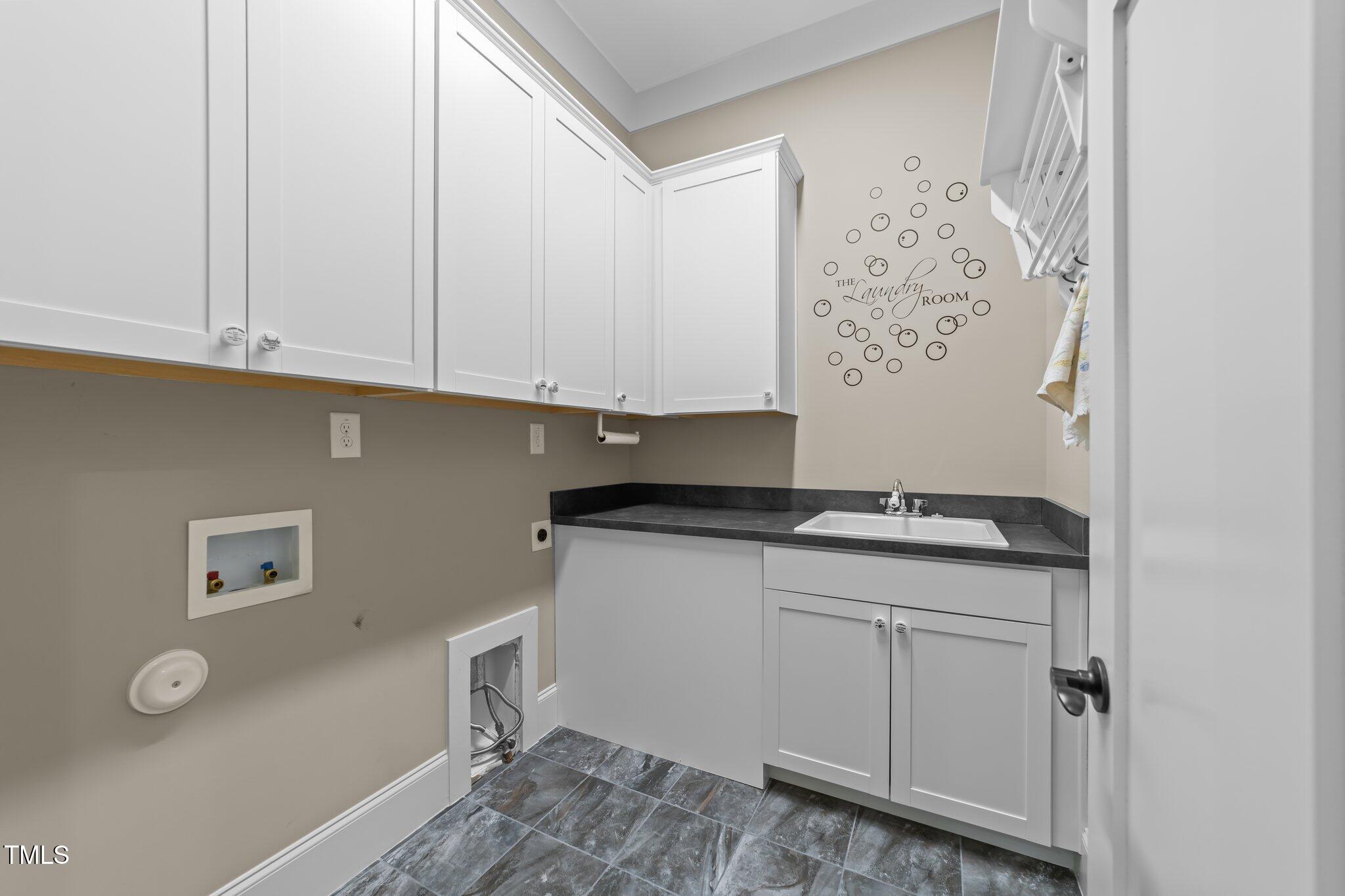 4924 Theys Road Raleigh, NC 27606 - Photo 43 of 74 Laundry room