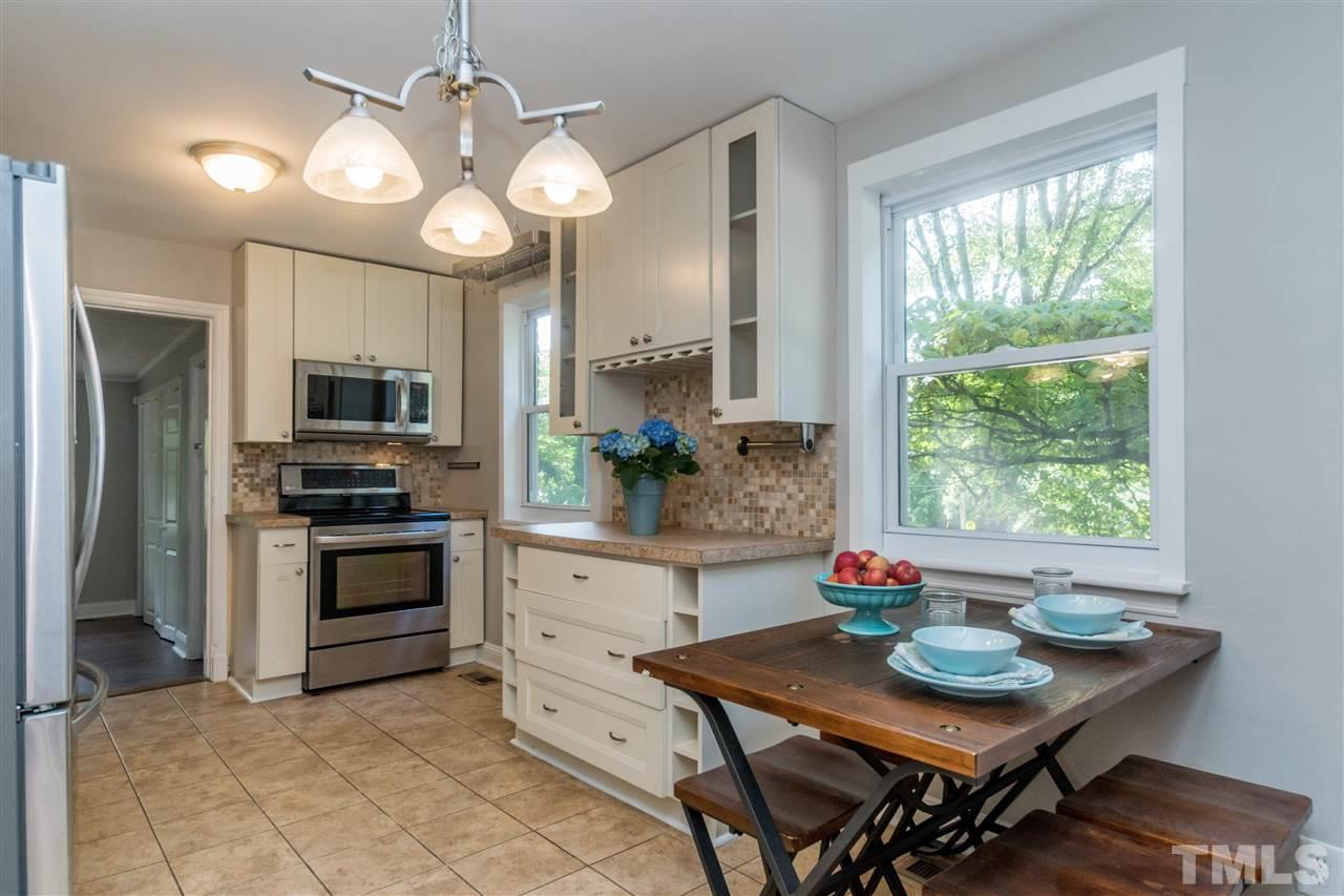 600 North King Charles Road Raleigh, NC 27610 - Photo 11 of 24 Natural light in kitchen with additional counter space/work area.
