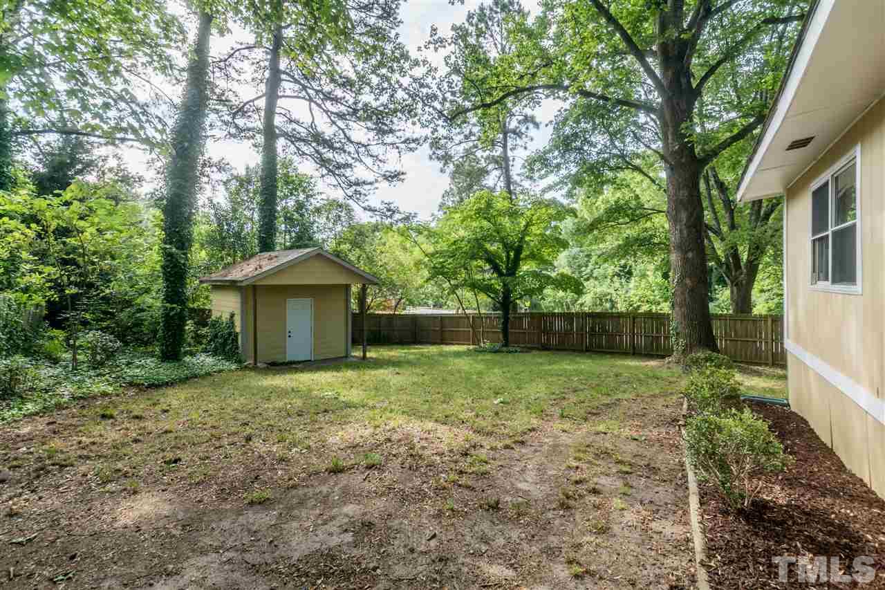 600 North King Charles Road Raleigh, NC 27610 - Photo 21 of 24 View of the shed and fenced in yard from the back of the house.