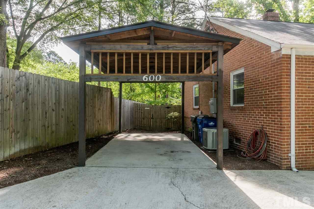 600 North King Charles Road Raleigh, NC 27610 - Photo 23 of 24 Oversize carport - large enough for many types of vehicles, but could also be used as an outdoor living area with a table, grill, chairs, etc.