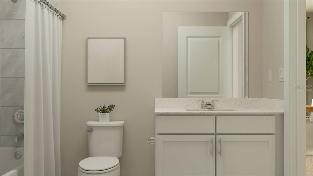 3261 Zuni Road St. Cloud, FL 34771 - Photo 12 of 21 a bathroom with a sink a toilet and mirror