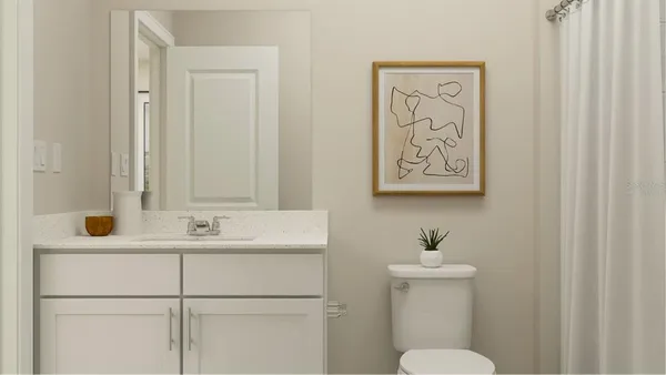 a bathroom with a sink a toilet and mirror
