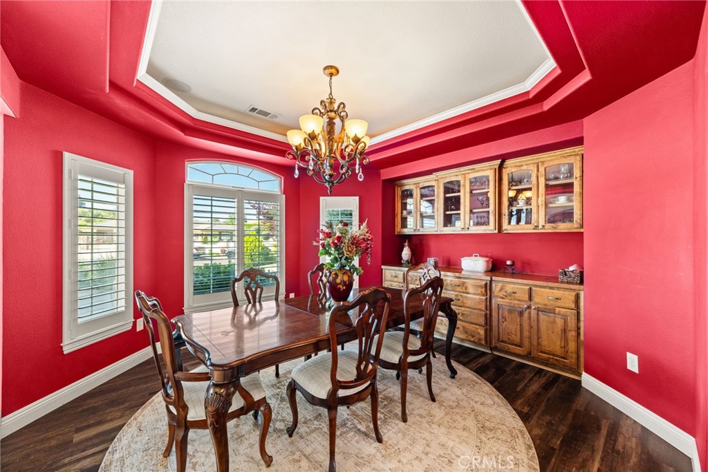 38136 Butterfly Court Yucaipa, CA 92399 - Photo 30 of 71 a view of a dining room with furniture and chandelier