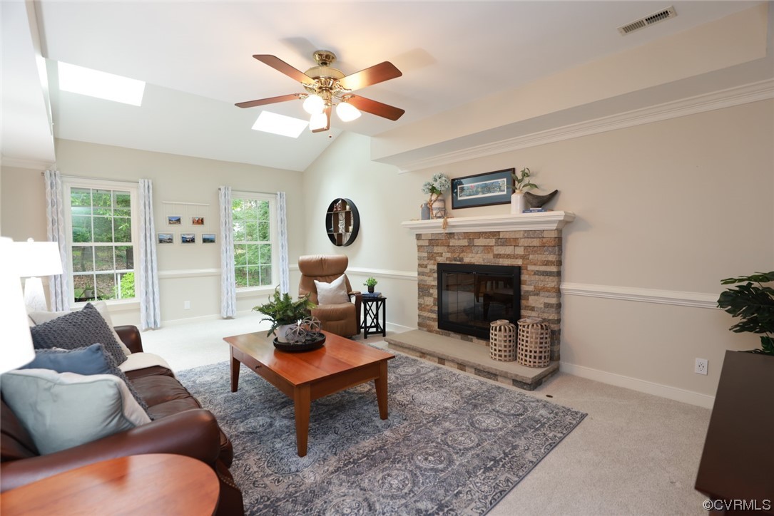 6314 Walnut Bend Drive Midlothian, VA 23112 - Photo 14 of 50 a living room with furniture a rug and a fireplace