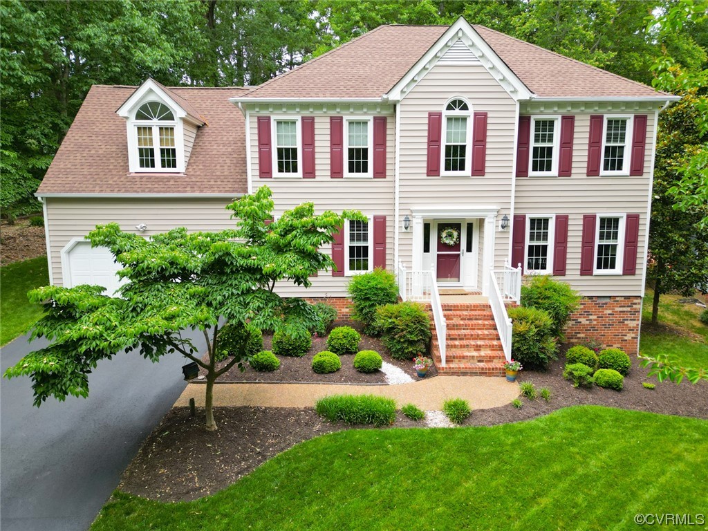 6314 Walnut Bend Drive Midlothian, VA 23112 - Photo 2 of 50 a front view of a house with a yard and green space