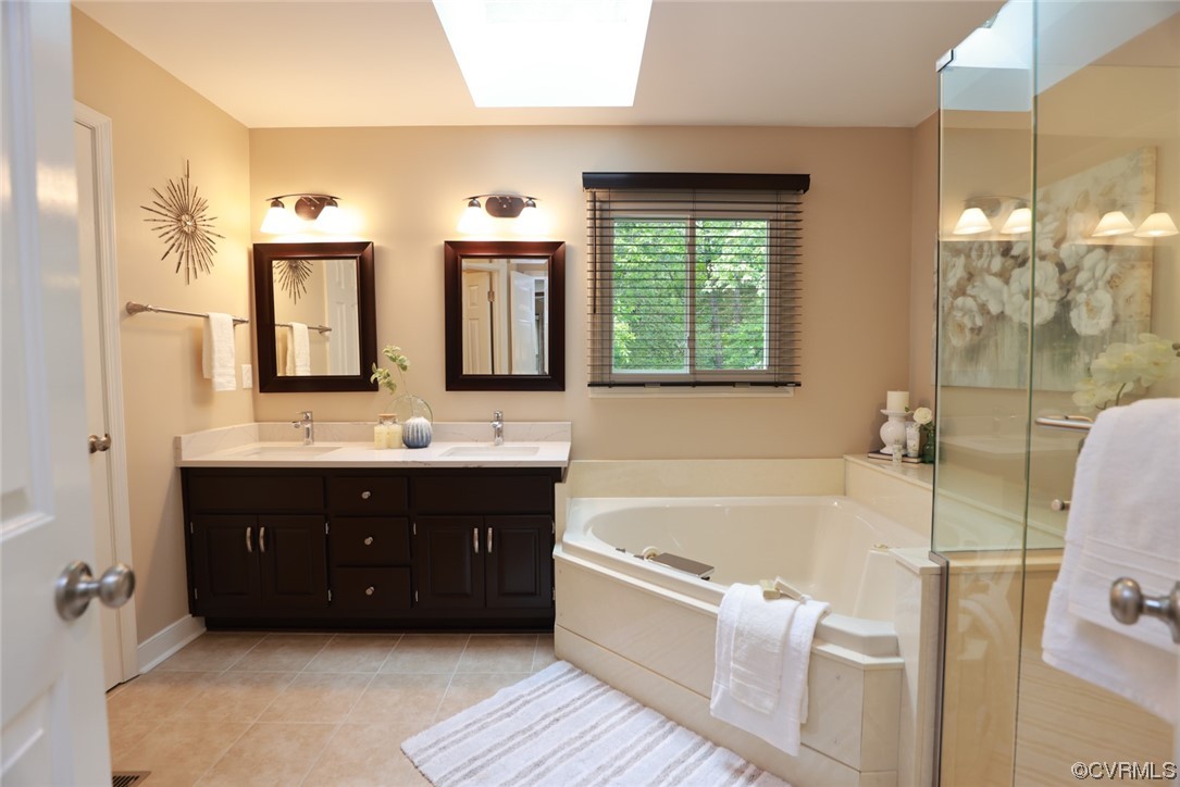 6314 Walnut Bend Drive Midlothian, VA 23112 - Photo 22 of 50 a bathroom with a tub a sink double vanity and a mirror
