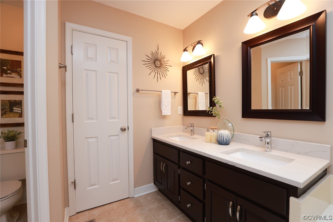 6314 Walnut Bend Drive Midlothian, VA 23112 - Photo 24 of 50 a bathroom with a double vanity sink and a mirror