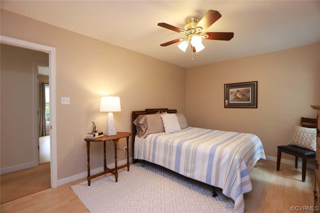6314 Walnut Bend Drive Midlothian, VA 23112 - Photo 26 of 50 a bedroom with a bed and a chandelier