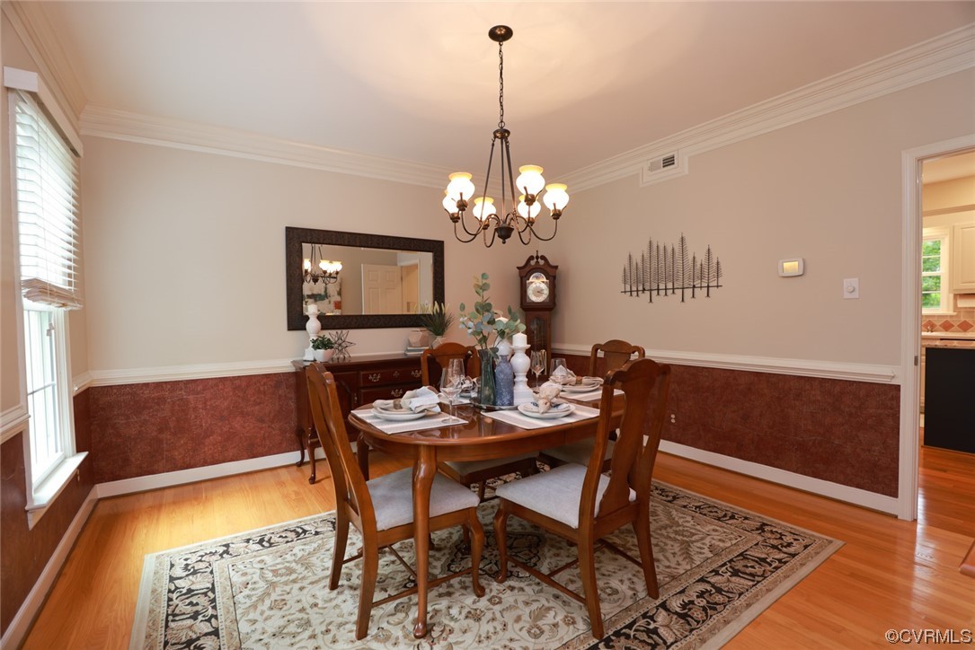 6314 Walnut Bend Drive Midlothian, VA 23112 - Photo 3 of 50 a dining room with chandelier and wooden floor