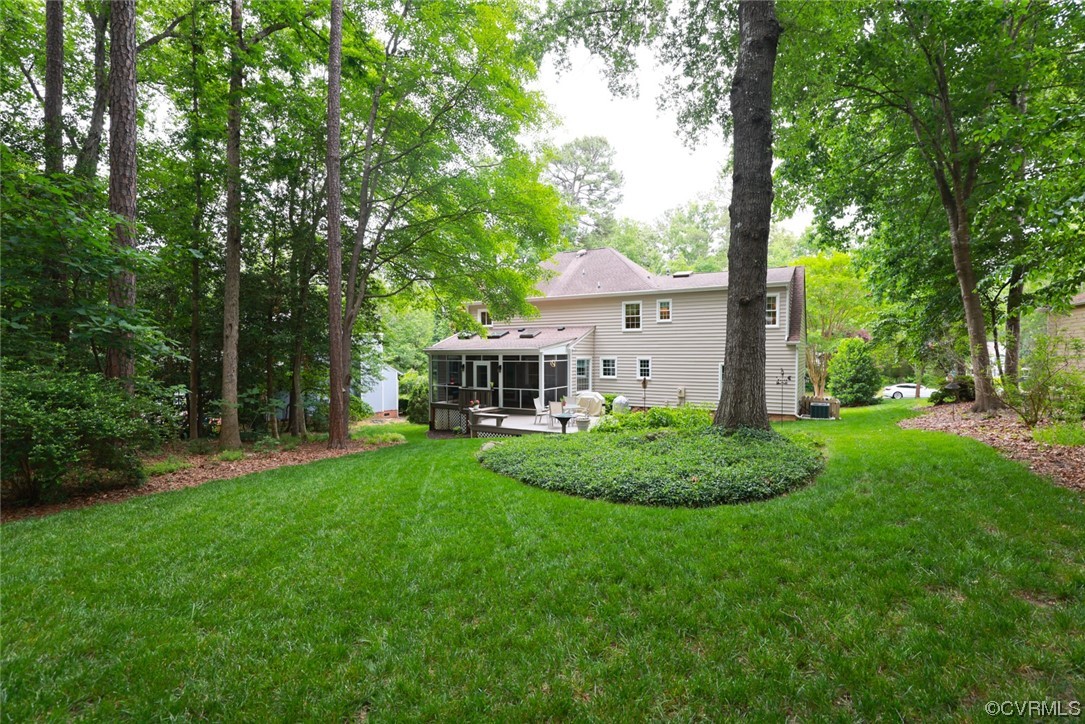 6314 Walnut Bend Drive Midlothian, VA 23112 - Photo 40 of 50 a house with green field in front of it