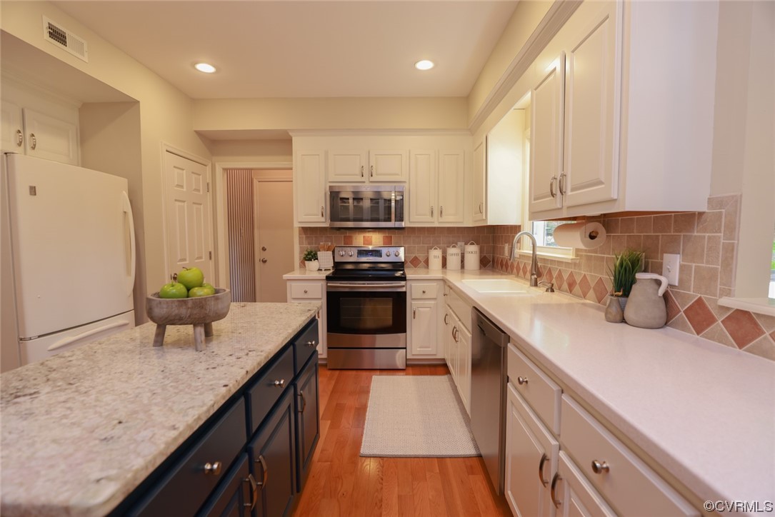 6314 Walnut Bend Drive Midlothian, VA 23112 - Photo 7 of 50 a kitchen with kitchen island granite countertop a sink a counter top space stainless steel appliances and cabinets
