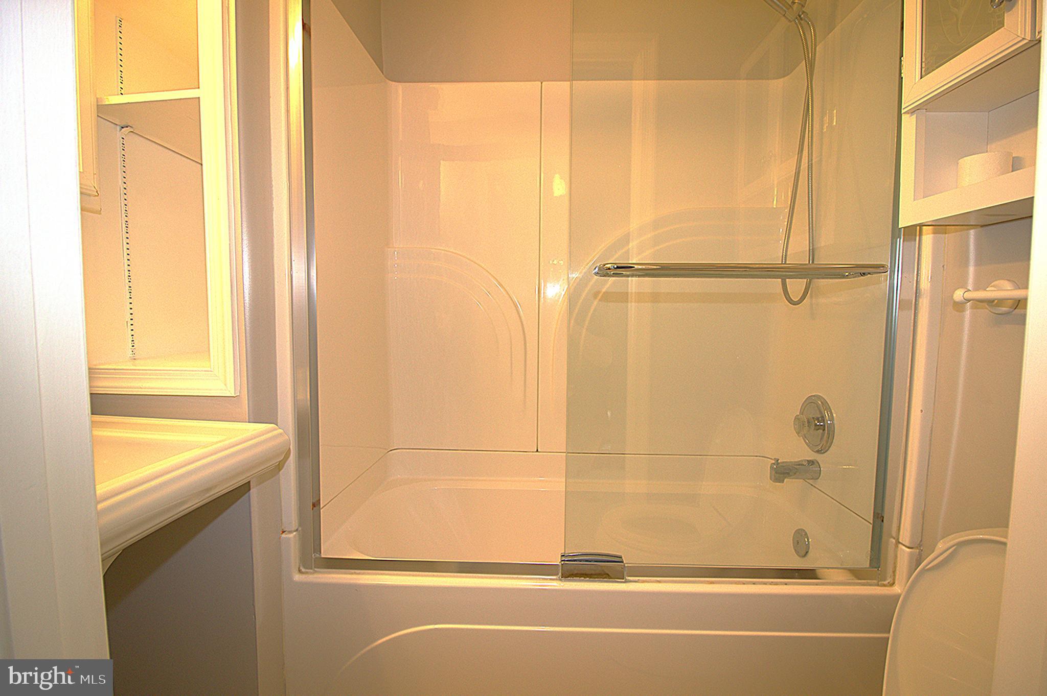 2919 Ritchie Avenue Baltimore, MD 21219 - Photo 21 of 24 a bathroom with a bathtub and a shower