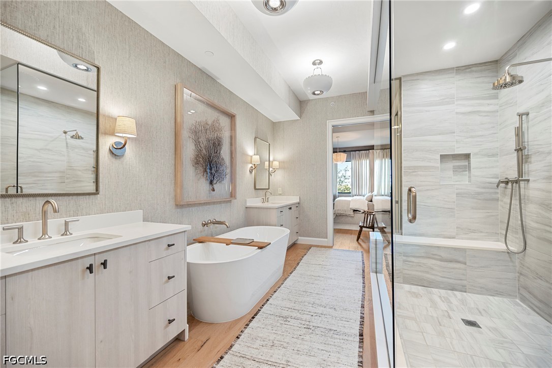 1115 Central Avenue, Unit 443 Naples, FL 34102 - Photo 25 of 40 a spacious bathroom with a double vanity sink mirror and double