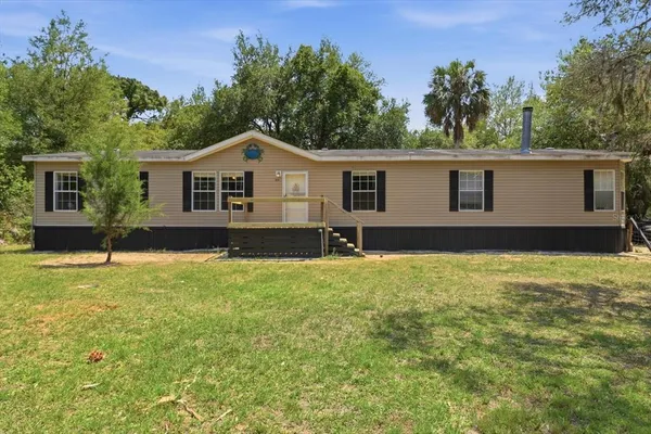 front view of a house with a yard