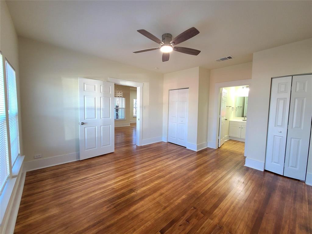 110 West Morton Street Denison, TX 75021 - Photo 11 of 15 a view of an empty room with wooden floor and a window