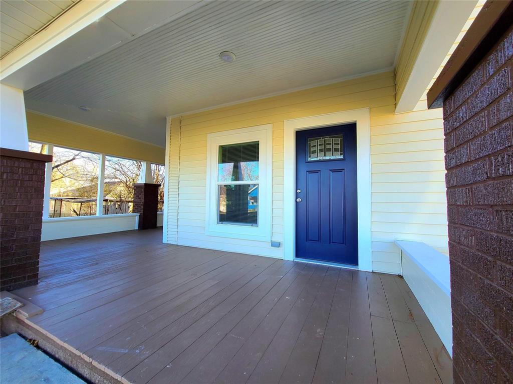 110 West Morton Street Denison, TX 75021 - Photo 2 of 15 a view of an empty room with wooden floor and a window