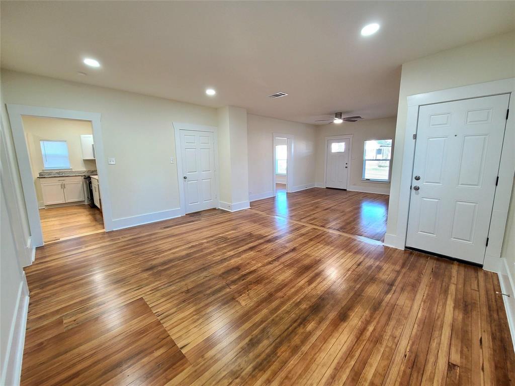 110 West Morton Street Denison, TX 75021 - Photo 5 of 15 a view of a room with wooden floor