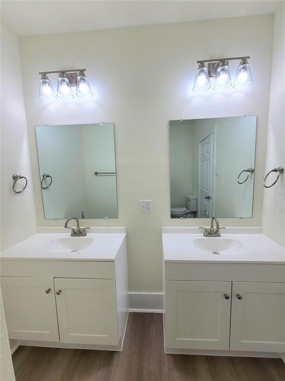 110 West Morton Street Denison, TX 75021 - Photo 9 of 15 a bathroom with a sink and a mirror